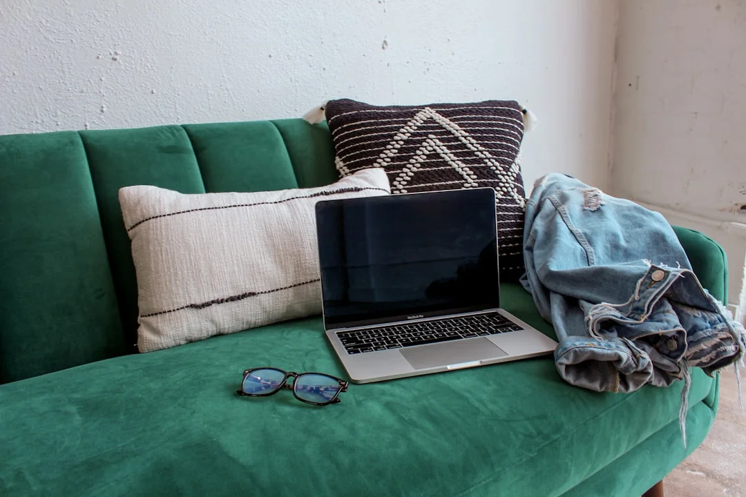 High-angle view of a stylish work desk featuring dual monitors, keyboard, mouse, and modern accessories.